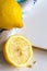 Lemons and cloth on white board background with copy space