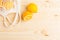 Lemons in cotton shopping eco friendly bag on wooden background with copyspace. Help for colds, natural remedies for the