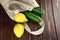 Lemons and cucumbers in reusable linen textile shopping bag