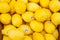 Lemons displayed at a produce market.