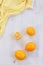 Lemons on a gray background with a yellow cloth