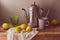 Lemons and tea pot on wooden table. Vintage rustic still life