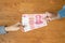 Lend or Giving money concept. Top view hand giving banknote currency Chinese Yuan (CNY or RMB
