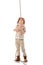 Length view of explorer kid in hat and glasses holding rope and looking up on white