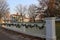 Length of white picket fence decorated for holidays, Genesee Country Village and Museum, New York, 2017.