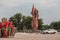 Lenin statue on Lenin square with flags in national colors and soviet retro car in Mozyr, Southern Belarus