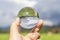 Lens ball with inverted paddy field and sky view inside