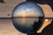 Lens ball shot of a fisherman floating on lake Zoetermeerse Plas during a beautiful sunset with a beautiful sky