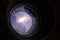 Lens of telescope with galaxy.