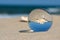 Lensball summer vacation landscape with starfish reflection. Travel and leisure concept.