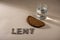 Lent Season, Holy Week and Good Friday concept - water, bread and text made of ashes