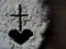 Lent Season,Holy Week and Good Friday concepts - Image of ash in shape of heart and cross on dark blurred motion background