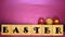 Lent Season,Holy Week and Good Friday concepts - word easter on wooden blocks with easter eggs background