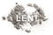 Lent word written in ash, sand or dust