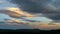 Lenticular clouds light up yellow as the sun sets, Yorkshire,UK