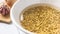 Lentil bowl with water on white background