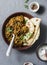 Lentil chicken curry sauce. Delicious indian healthy food on grey background, top view