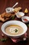 Lentil cream soup in a bowl with spices turmeric, paprika and garlic