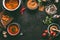 Lentil dishes food background. Lentil soup with cooking ingredients on dark rustic kitchen table background, top view. Healthy