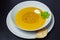 Lentil soup in a ceramic white bowl on a golden background