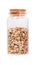 Lentils in a glass bottle with cork stopper, isolated on white.