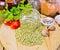 Lentils green in jar with parsley on board