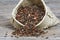 Lentils in small hessian bag on wooden table