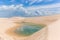 LenÃ§Ã³is Maranhenses national park, known for its huge desert landscape of tall, yellow sand dunes and seasonal rainwater pool.