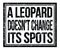 A LEOPARD DOESN`T CHANGE ITS SPOTS, text on black grungy stamp sign