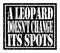 A LEOPARD DOESN`T CHANGE ITS SPOTS, text written on black stamp sign