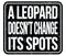 A LEOPARD DOESN`T CHANGE ITS SPOTS, words on black stamp sign