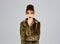 Leopard fur at stylish girl. leopard fur on pretty woman on grey background