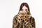 Leopard fur at stylish girl. leopard mittens and fur on pretty woman isolated on white.