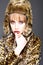 Leopard fur at stylish girl. Look of fashion model with bad taste. Fur coat boutique with natural and artificial
