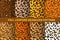 Leopard or jaguar seamless pattern made of fall leaves. Trendy animal print with autumn colors. Set of vector