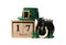 Leprechaun`s hat, block calendar and St. Patrick`s day decor on white background