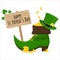 A leprechaun`s shoe with gold coins, a sign with the inscription St. Patrick`s Day decorated with shamrocks.
