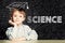 Lern Science. Clever student child on blackboard background