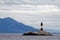 Les Eclaireurs Light House on rocky island on the Beagle Channel - Argentina