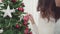 Lesbian Asian couple feeling happy decorating christmas tree in her living room at home in Christmas Festival.