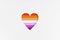 Lesbian flag on Heart shape isolated on white cardboard background