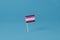 Lesbian flag standing on a blue background