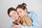 Lesbians lgbt couple. Portrait of two cheerful young women with mobile phone, smartphone. Two beautiful young women with