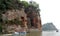 The Leshan Grand Buddha near Chengdu in China with tourist boat