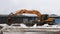 Leskovka, Belarus - 20 March 2021: Crawler excavator Hyundai is breaking metal profiles and heaping them up