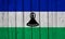 Lesotho Flag Over Wood Planks