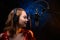 Lesson and training in vocal and singing. A girl sings into a microphone, bright background