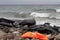 LESVOS, GREECE OCTOBER 24, 2015: Lifejackets, rubber rings an pieces of the rubber dinghys discarded on a beach near Molyvos.