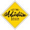 Let the adventure begin handwritten lettering on yellow rhombus background. Vector calligraphic road sign