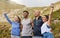 Let all your efforts will add up to greatness. a group of sporty young people cheering while exercising outdoors.